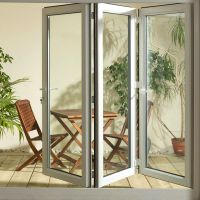 Glass door systems with folding glass door walls make a functional, flexible glass wall for dynamic use-changing seasons